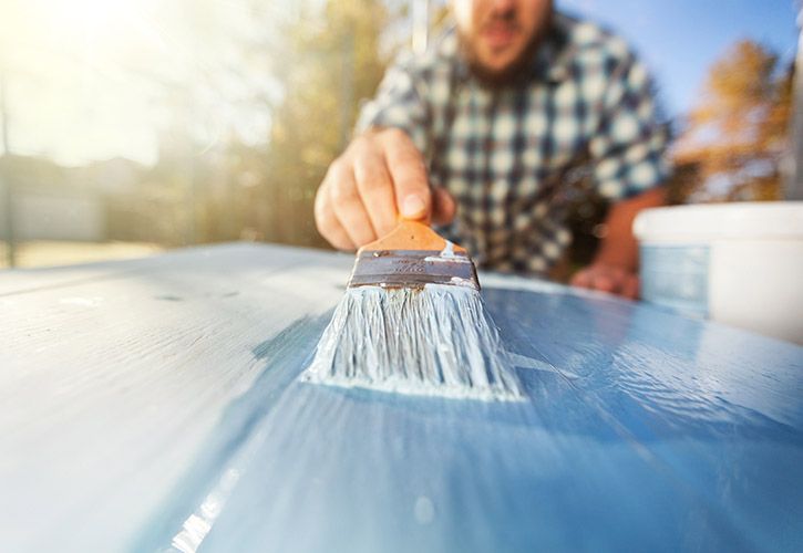 Man painting outside.jpg