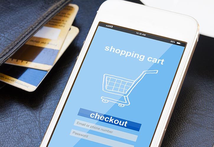 Mobile with shopping trolley and bank cards shutterstock_265411373 725 x 500