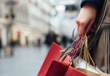 Female shopper carrying bags shutterstock_357891440 725 x 500