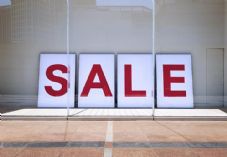 Sale sign in window - shutterstock_291593120 - 725 x 500