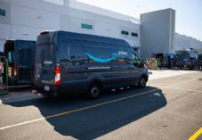 Amazon delivery vans in loading lot area