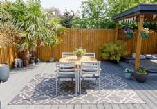 Garden patio decking table gazebo Mark Dean iStock-2151855373